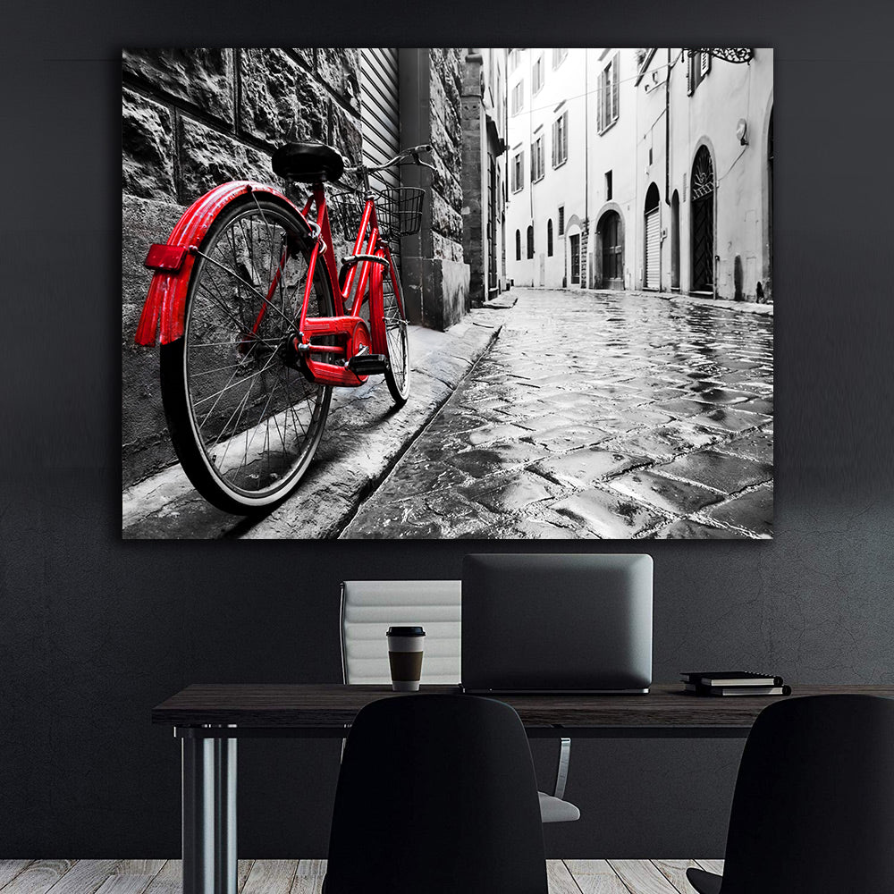 Leinwandbild - Rotes Fahrrad in der Stadt