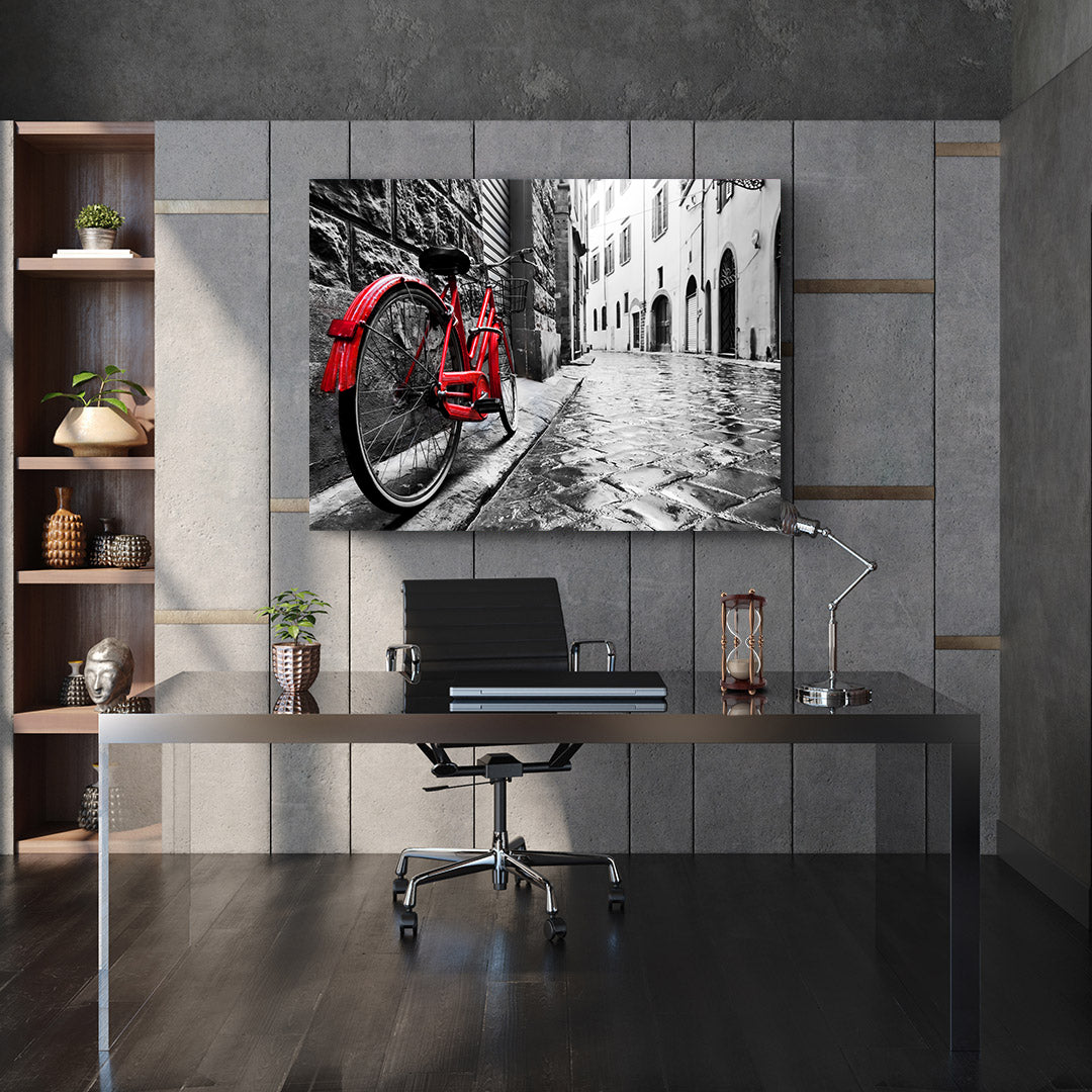 Leinwandbild - Rotes Fahrrad in der Stadt