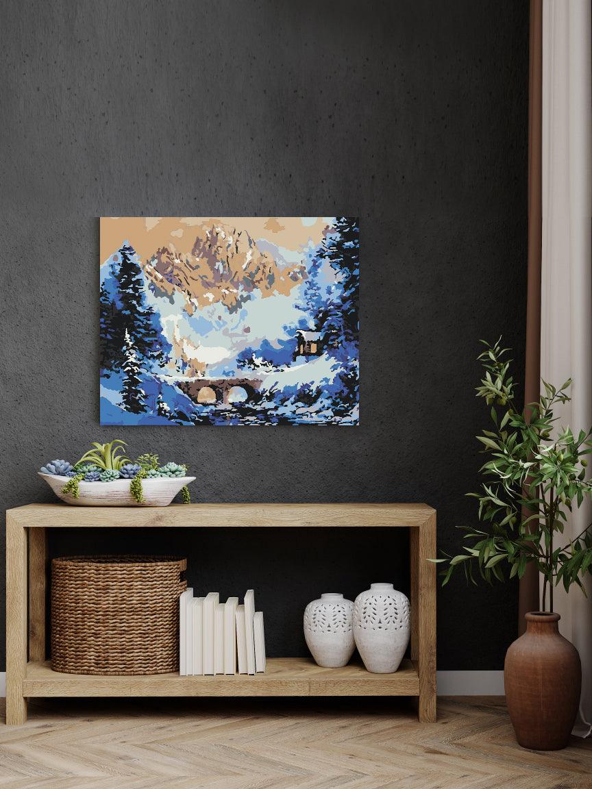 a painting on a wall above a wooden shelf